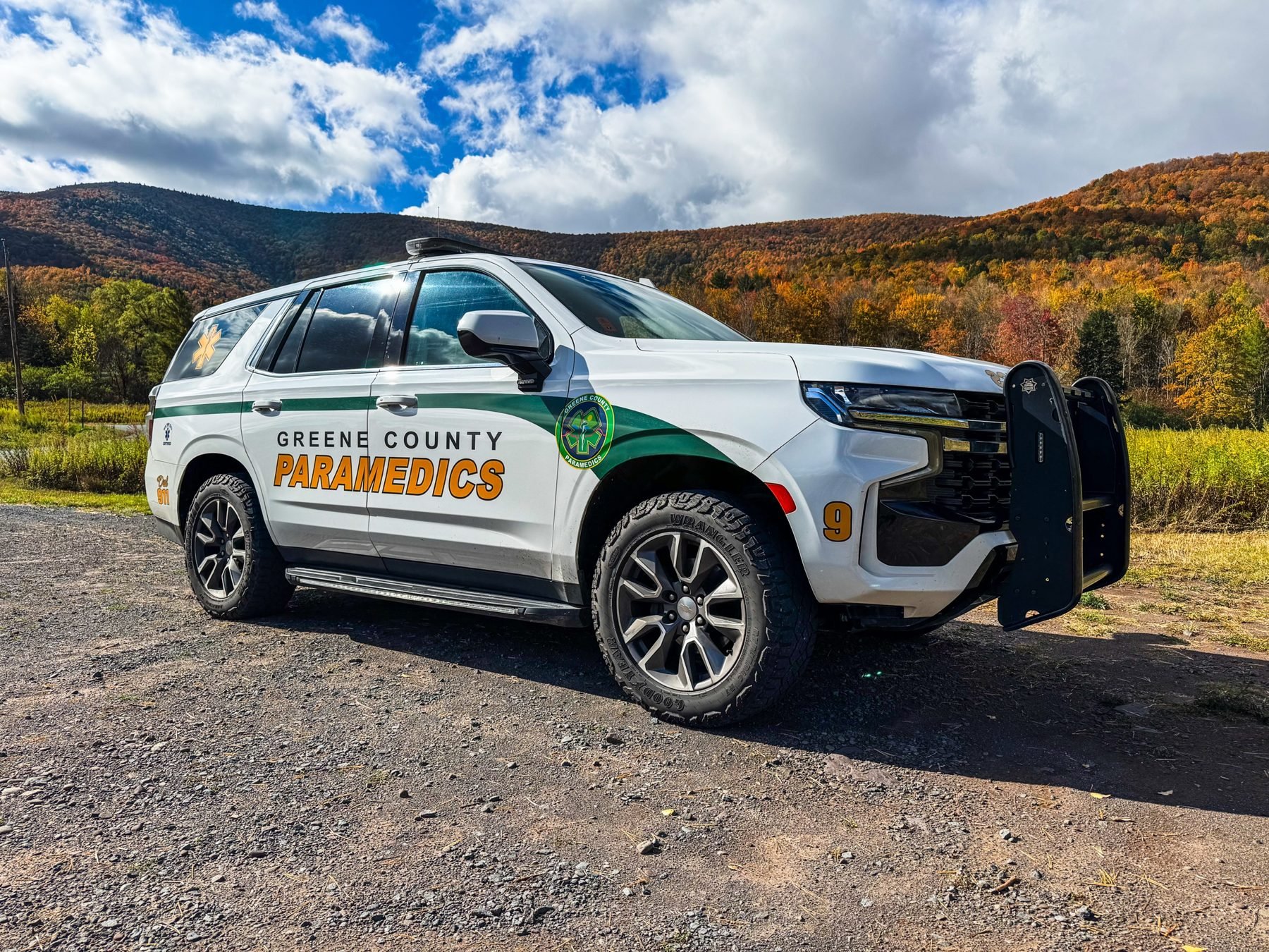 Greene County Paramedics Medic 9 fly car in front of Catskill Mountain fall foliage